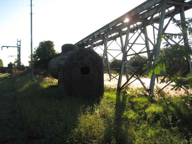 An old boiler, the coal stage ramp and the low evening sun