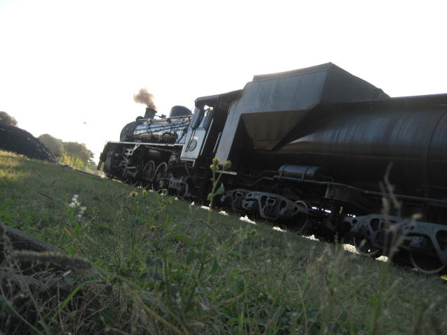 3664 at the foot of the coal stage ramp with the evening sun behind her