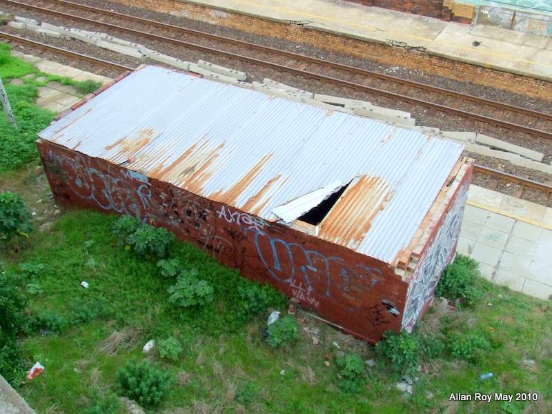 No idea why this building still has a roof on, but someone seems to be living there.