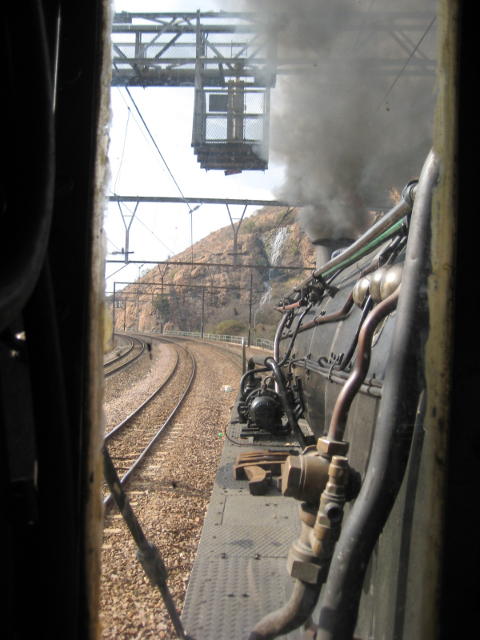 The white of the artificial waterfall stands out next to the black boiler of 2650 as we head for Wonderboom and Pretoria North