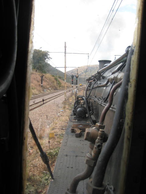 A red signal on the adjacent line, green on our line, a yellow Metro set approaches, all set against the black of 2650's boiler