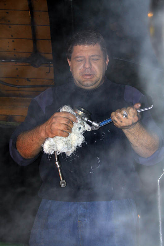Fireman prepares to grease