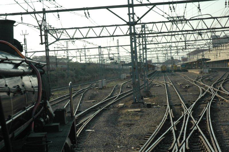 The 150th anniversary train winds its way over the crossovers in Pretoria station, whilst the Metro sets await their passengers.