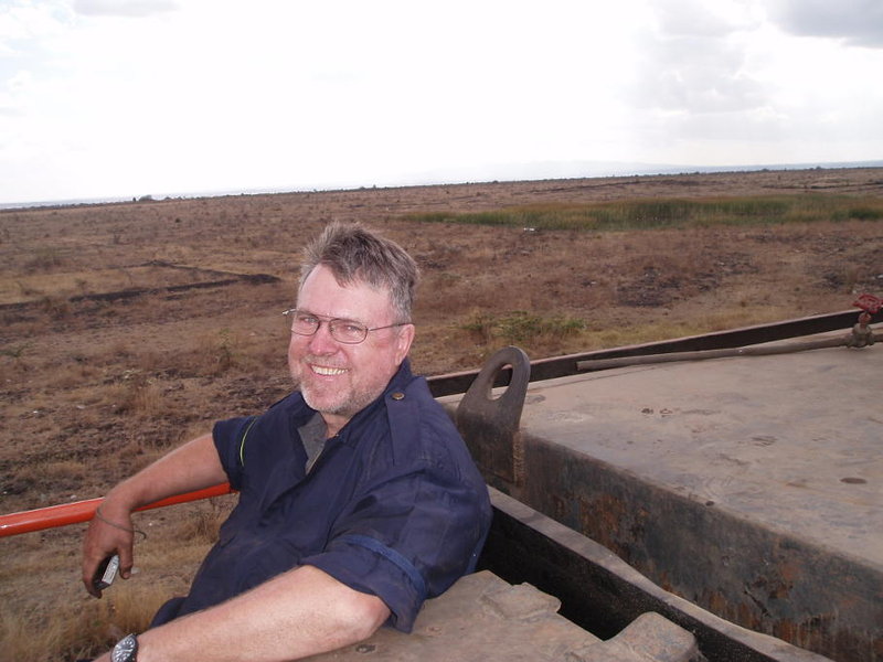 John sits on the tender with the Nairobi National Park in the background. We saw Thomson's gazelle, zebra, impala and hartebeest. Photo by Erik