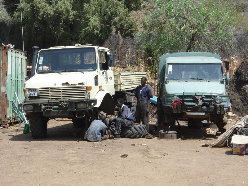 Two other Unimogs receive some TLC in preparation for the rainy season, when they will be used extensively