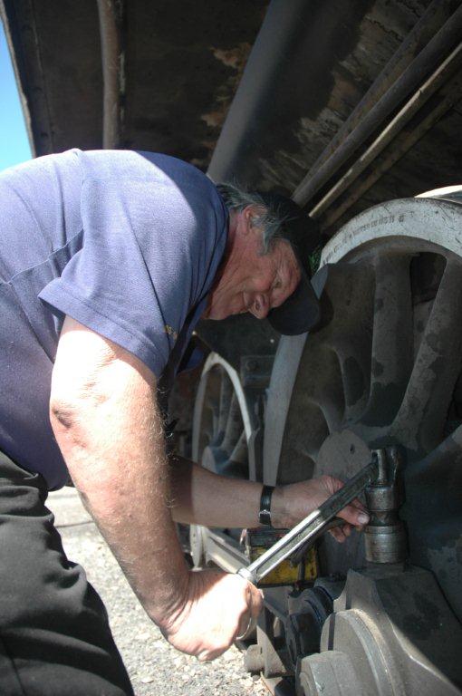 Tony Attwell does a timeless job of hard greasing the locomotive, having just arrived at Cullinan.