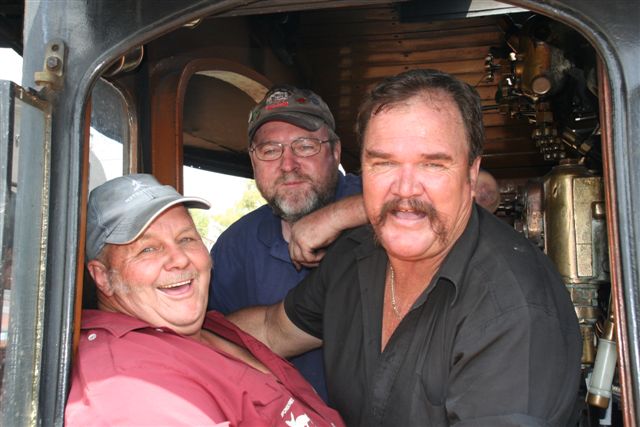 The "Snor Snapshot Shootout". Piet, John and Manie model their facial hair from the cab catwalk..