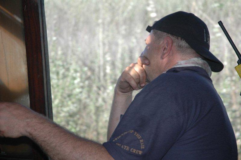 Concentration on the rails ahead. Driver Gabor Kovacs is keeping a lookout. The two way radio behind him is so positioned that he can hear any calls from the Guard or Train Manager.