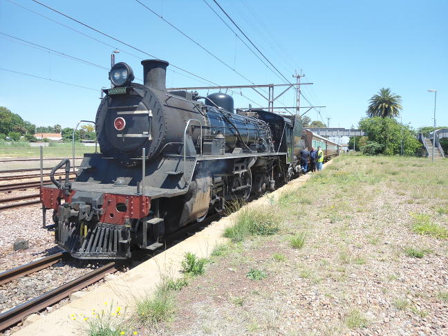 The train stands at Rayton while passengers board, the wooden staff is collected and permission to pass a signal at danger is obtained from CTC