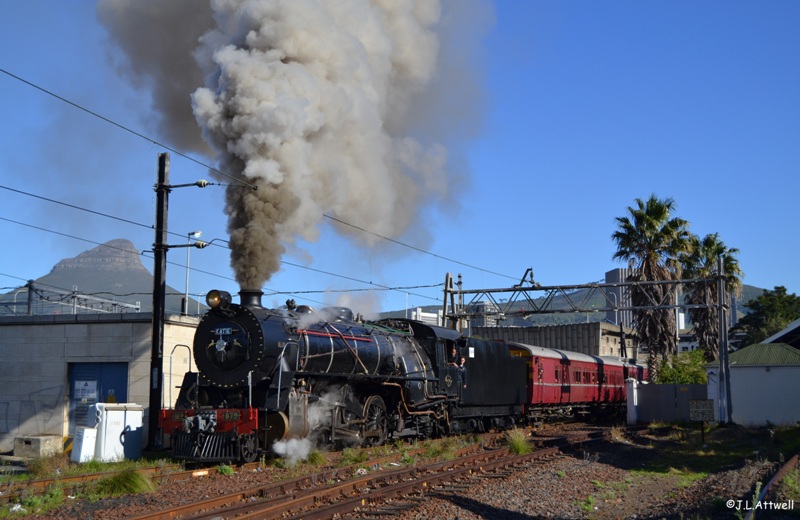 With the passengers onboard and the route set for the mainline, 879 departs monument station with plenty of smoke.