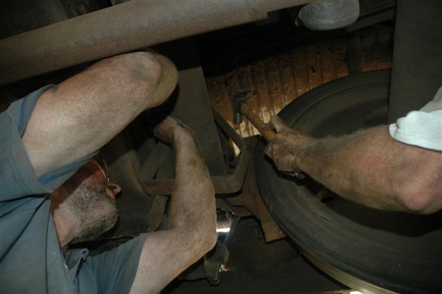 Reaching new heights with some hammer power! John Ashworth gets to grips with a brake beam on one of the suburban coaches undergoing brake modifications. Tom Mcrery is lending a hand hammering the point home!