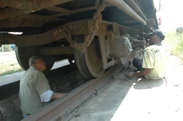 "Now lessee, da thing goes here or der?" John Madisha and Tom Mcrery get to grips with a brake block conversion on one of the FOTR vehicles. The cast iron blocks are to be replaced by the composite type
