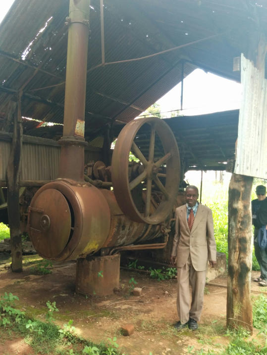 An elderly engineer stands next to one of the Rustons.