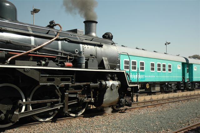 Spoornet's green &amp;quot;Baluleka&amp;quot; train set makes a colourful contrast to 3664. as the locomotive stands ready to collect some old coaches up at Pretoria Station.<br /><br />Photo by Nathan Berelowitz, 15/07/07