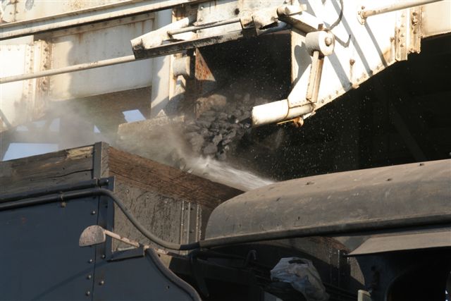 Coaling operation - a sizzle of flying rocks and vapourized spray...