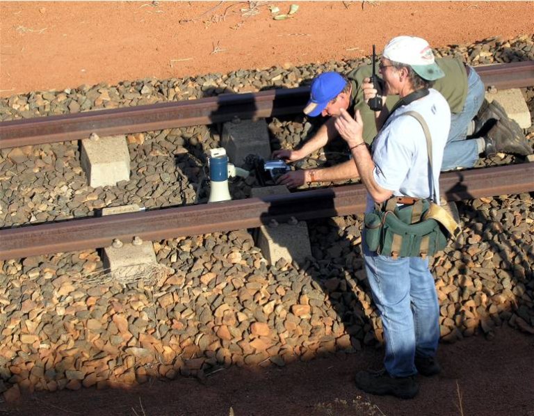 Chris Janisch worshipping the very tracks trains travel on!