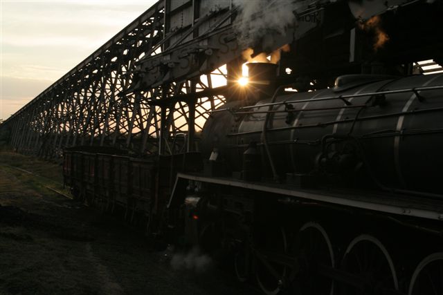The smoke catches the sun's glint as the dolly propels our NZ truck away from the coalstage.