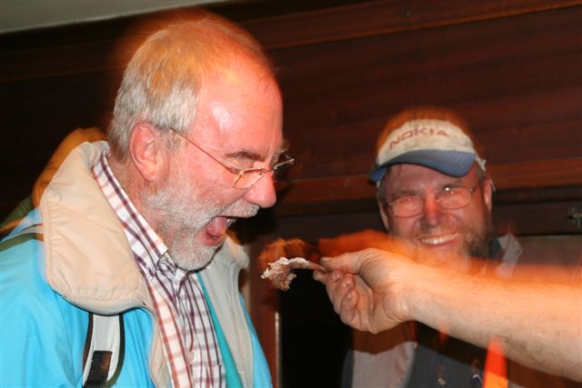Old member Charles Janssen-Schmidt eats the FOTR initiation "salted lambeentje" - John A looks on..