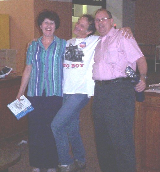 Joan and Nigel give Nathan a squeeze