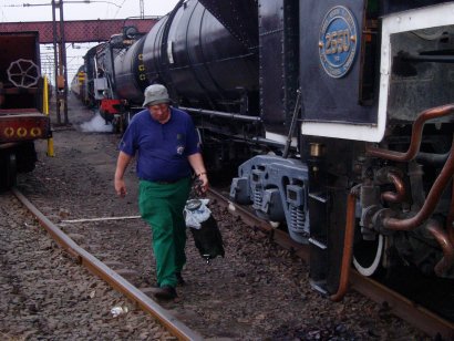 ...but first third man Tony has to refill the water bottle for the footplate crew<br /><br />Photo by John Ashworth 26/08/07