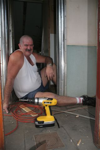 One man and his tool. Pekingese takes a break while restoring our new coach.