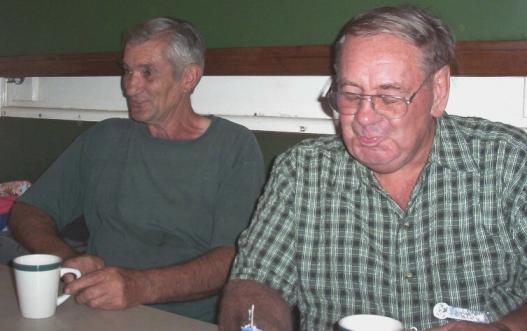 Uncle John and the late Coen M enjoying a chuckle and a non-alcoholic drink.