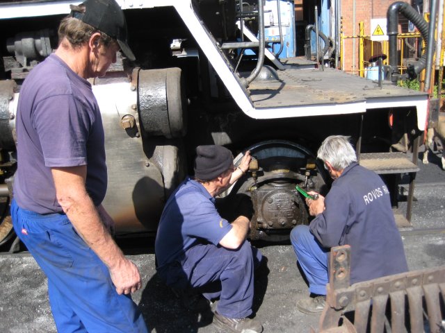 Les looks on while Nathan (left) and Uncle John fit a new pipe