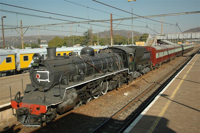 Mid-winter Tshwane Xplorer, the Outeniqua Tjoo Tjoo of Gauteng, stops for a while at Pretoria North station, for passengers to have their non-coal smoke break. Viewed from the signal cabin. Loco 3664 class 24 JoAnna