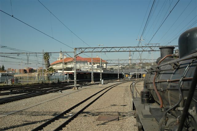 Mid year regular month-end steam working the "Tshwane Xplorer" approaches the Capital city's main station. This magnificent building, designed by Sir Herbert Baker, still gets to witness regular steam operations. FOTR class 24 JoAnna number 3664 hauls the mid winter train around the complex route.