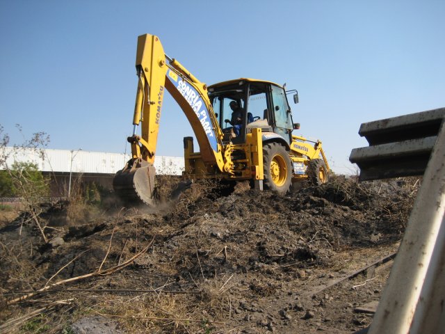 Loosening the hard-packed earth at the eastern end of the platform
