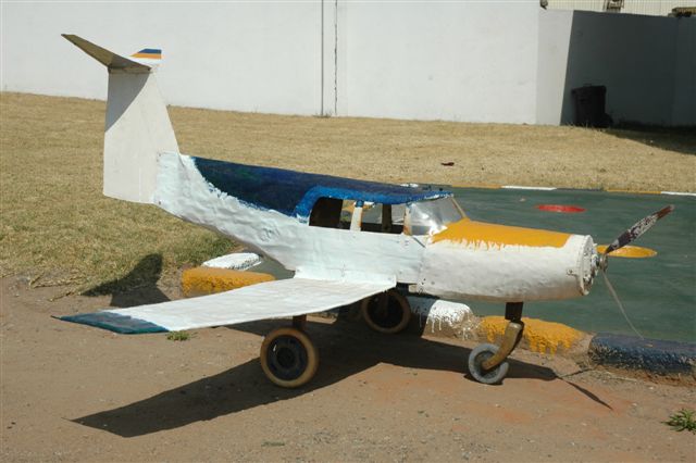 Cullinan airport! Tin aircraft at the art and craft village near the station. This is a one seater economy ground bus!