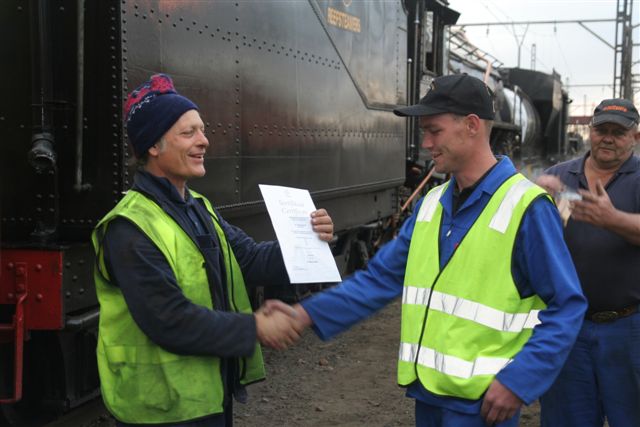 Awards ceremony railway style! Dewald receives his guard certificate.