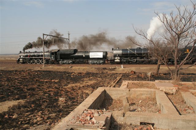 Railway decay. Destroyed railway houses near Olifantsrivier bear witness to the passage of a steam train..