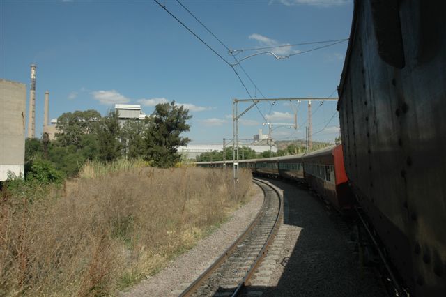 Passing the PPC cement factory Northbound coming down from Capital Park way, the train takes the turn. Out of site, to the rear of the photographer, lies<br />FOTR's new site at Hercules