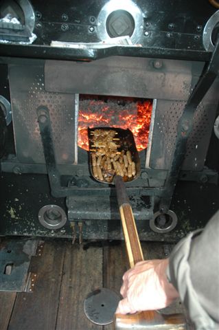 Fire, food,fuel for the soul. Gourmet meal being prepared in the firebox on a trusty shovel