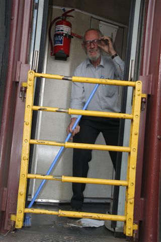 Why, it's that nutty professor John Mathieson, seen here tidying up the mainline coach after a long day's use!