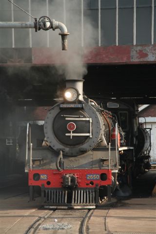 Nestled inside the shed, 2650 has her grate shaken before being stabled for the night.