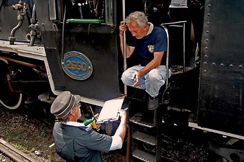 Guard Nathan presents the paperwork to driver Cliff
