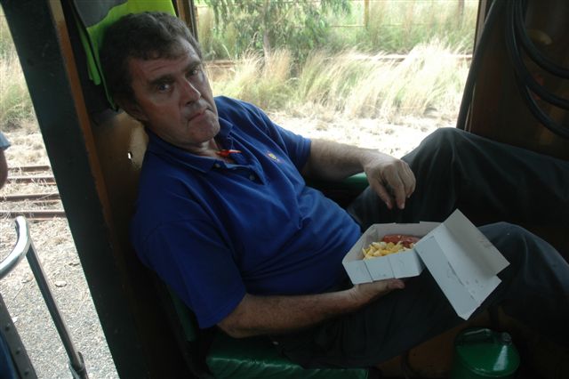 Having had a hard time firing the loco to Cullinan, trainee Steve Smith enjoys a lunch in the comfort of the 24's cab