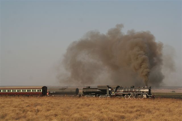 No fires please! Plenty smoke but no sparks for the tinder-dry grass at the end of a long dry season, on the approach to Zonkolol.