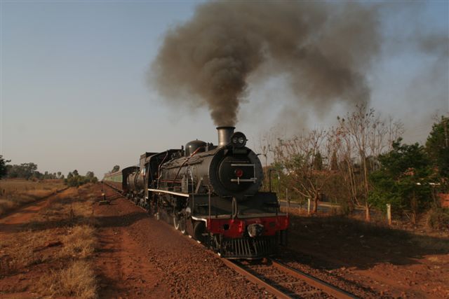 With plenty of smoke to spare, 3664 is seen running through Rayton as the shadows lengthen. The end of another glorious spring day on the Highveld.
