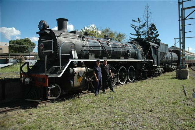 Awaiting departure from Hermanstad site, sees Driver Frik Boshoff and Fireman Nathan Berekowitz posing, whilst Third man, Steve Smith, operates the camera