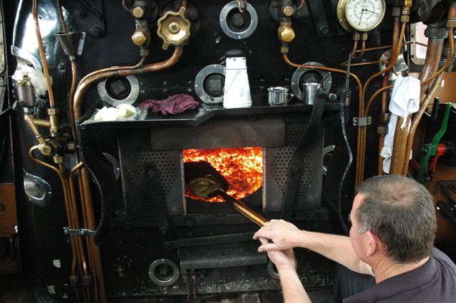 Nothing can beat a footplate shovel braai! Frik Boshoff tests his grilling skills in the firebox of a 19D locomotive at Cullinan