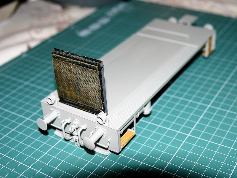 Radiator, headlights and some other bits in place.