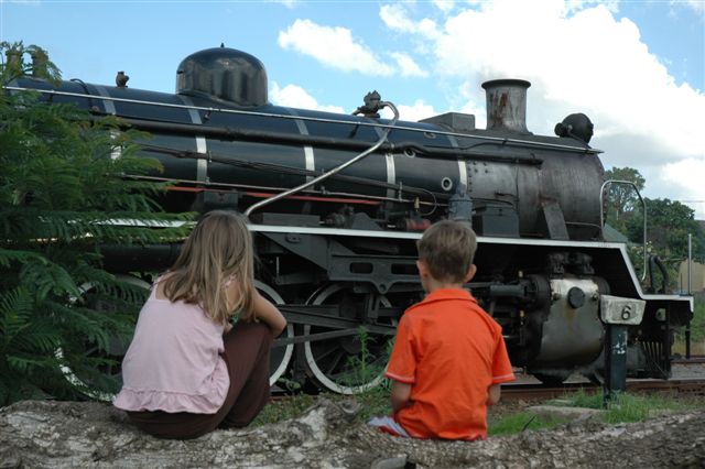 The future looks at the past in the present. Trains are a fascination, especially the steam ones. Two kids admire the<br />FOTR class 24 as she rests at Cullinan.