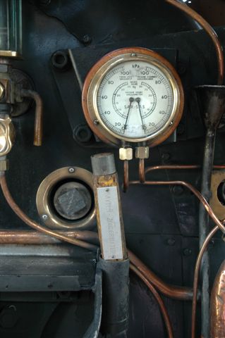 The wooden train staff used on the branch line from Rayton to Zonderwater,<br />lies secure in its holder on the firebox flameplate, so driver will be<br />constantly reminded of his method of train working.