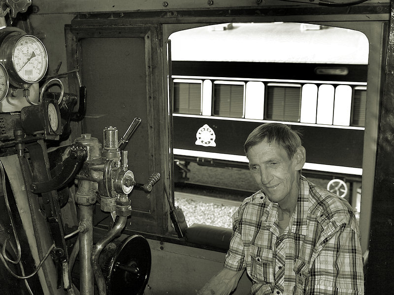 Gert van Vuuren also reflects on some of the machinery (at Rovos, Capital Park)  in front of him!!!!   K R Wilson-Smith Nov 2009