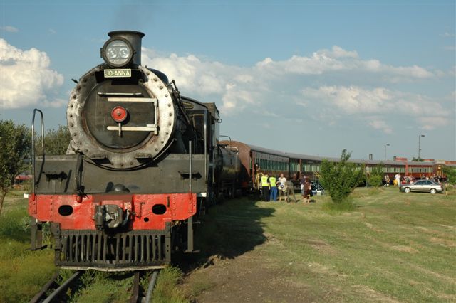 Journey's end and the charter group passengers disembark. Soon the load will<br />be shunted into the compound and the loco fire dropped. Sun will set and all<br />will be peaceful.