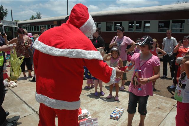 Santa was on hand in this snowless region, to hand out gifts to the passengers.