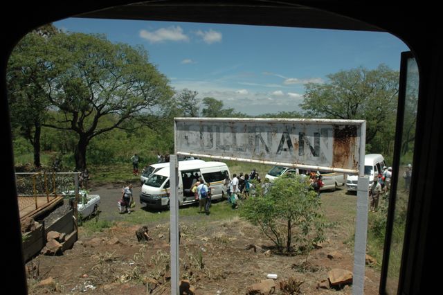 Framed through the cab window of a 15F, this nameboard must have witnessed many a train stopping here. In the background are the Taxis and FOTR passengers ready to head off to the village